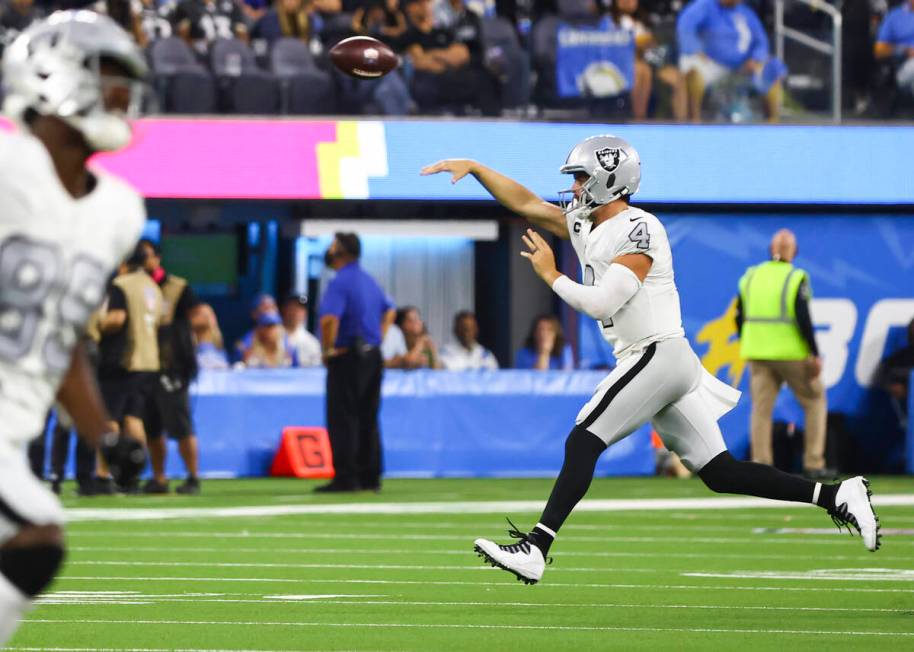Raiders quarterback Derek Carr (4) throws a pass during the second half of an NFL game against ...