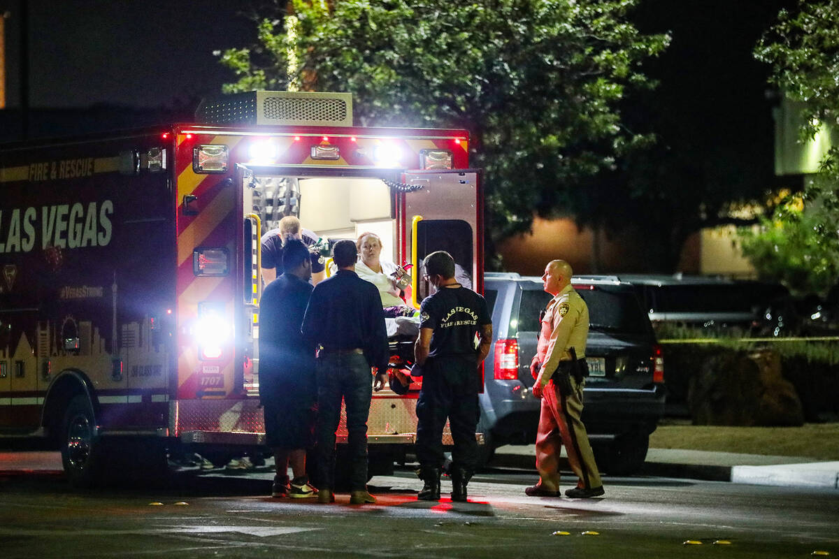 A woman is lifted into an ambulance after an officer involved shooting near the 4100 block of P ...
