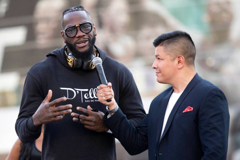 Heavyweight champion Deontay Wilder speaks with Ray Flores during a press conference at Toshiba ...