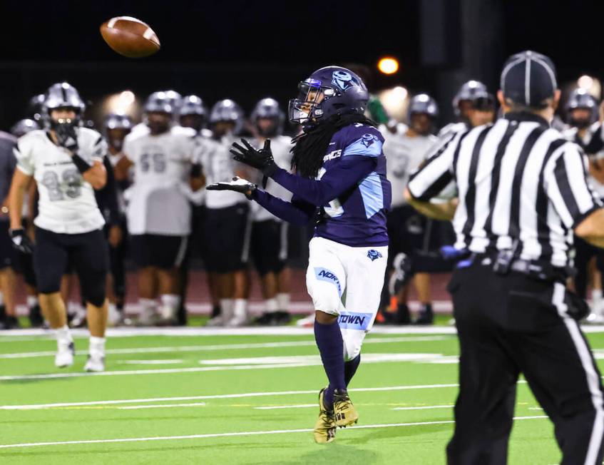 Canyon Springs' Dionn Whittaker (3) reaches out for a reception before scoring a touchdown on t ...