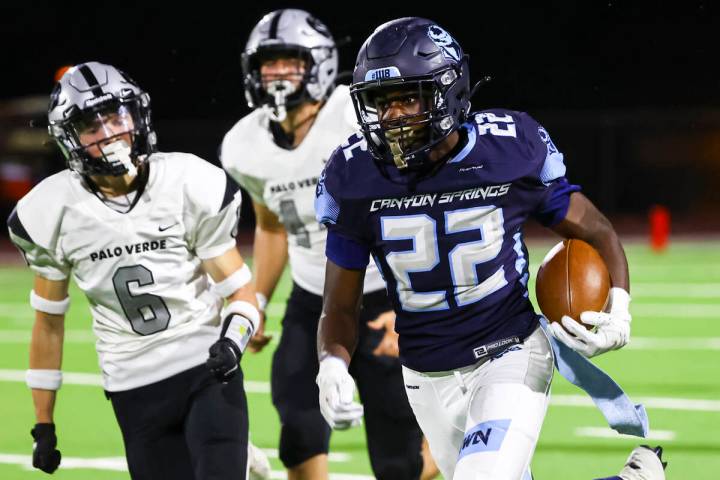 Canyon Springs' Omarion Ireland (22) runs the ball to score a touchdown against Palo Verde duri ...