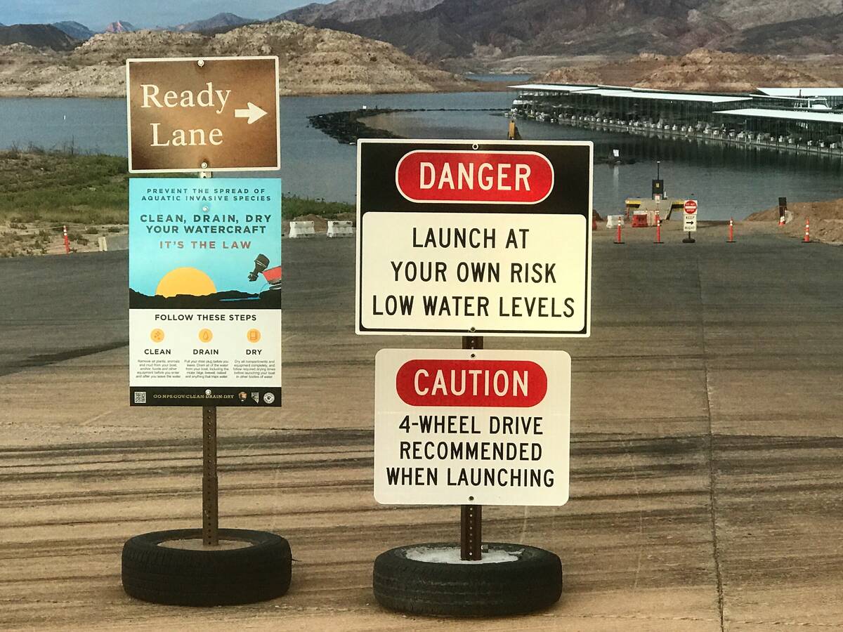 Signs warning of low-water conditions greet boaters at the Hemenway Harbor Launch Ramp at the L ...