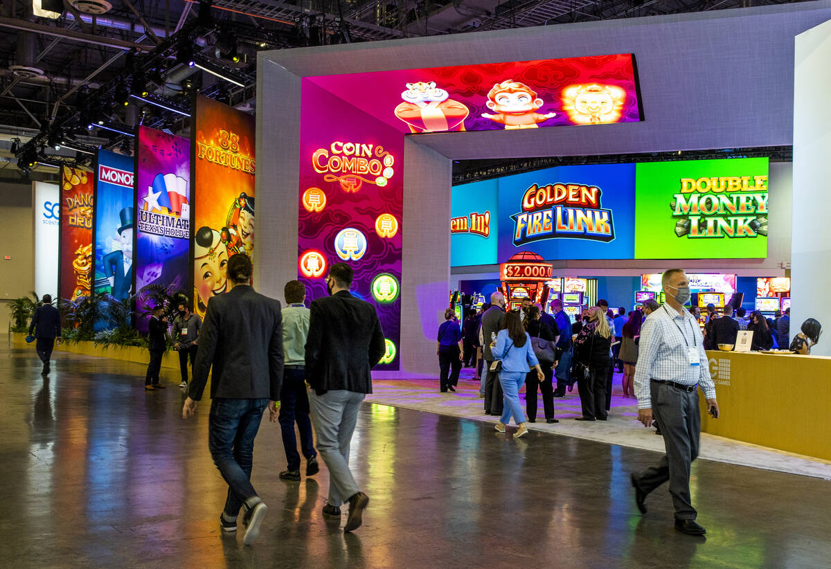 Attendees stroll about the Scientific Games Corp. display area during day 3 at the Global Gamin ...