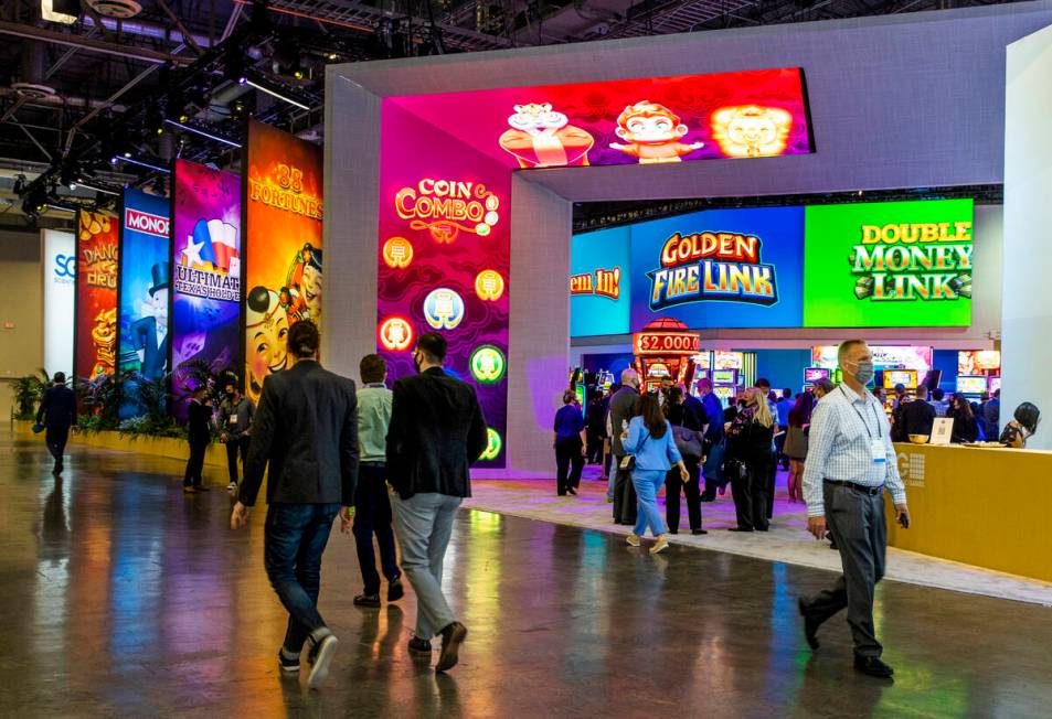 Attendees stroll about the Scientific Games Corp. display area during day 3 at the Global Gamin ...