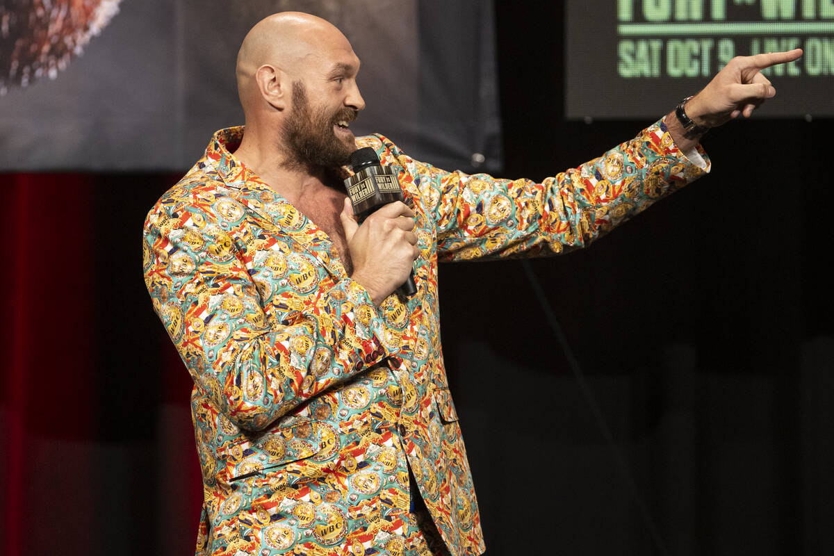 Tyson Fury speaks during a press conference in advance of his heavyweight title fight against D ...