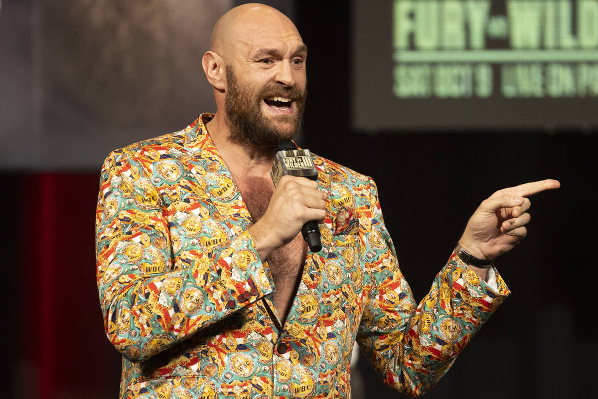 Tyson Fury speaks during a press conference in advance of his heavyweight title fight against D ...