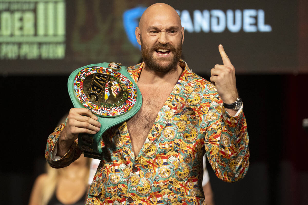 Tyson Fury poses during a press conference in advance of his heavyweight title fight against De ...