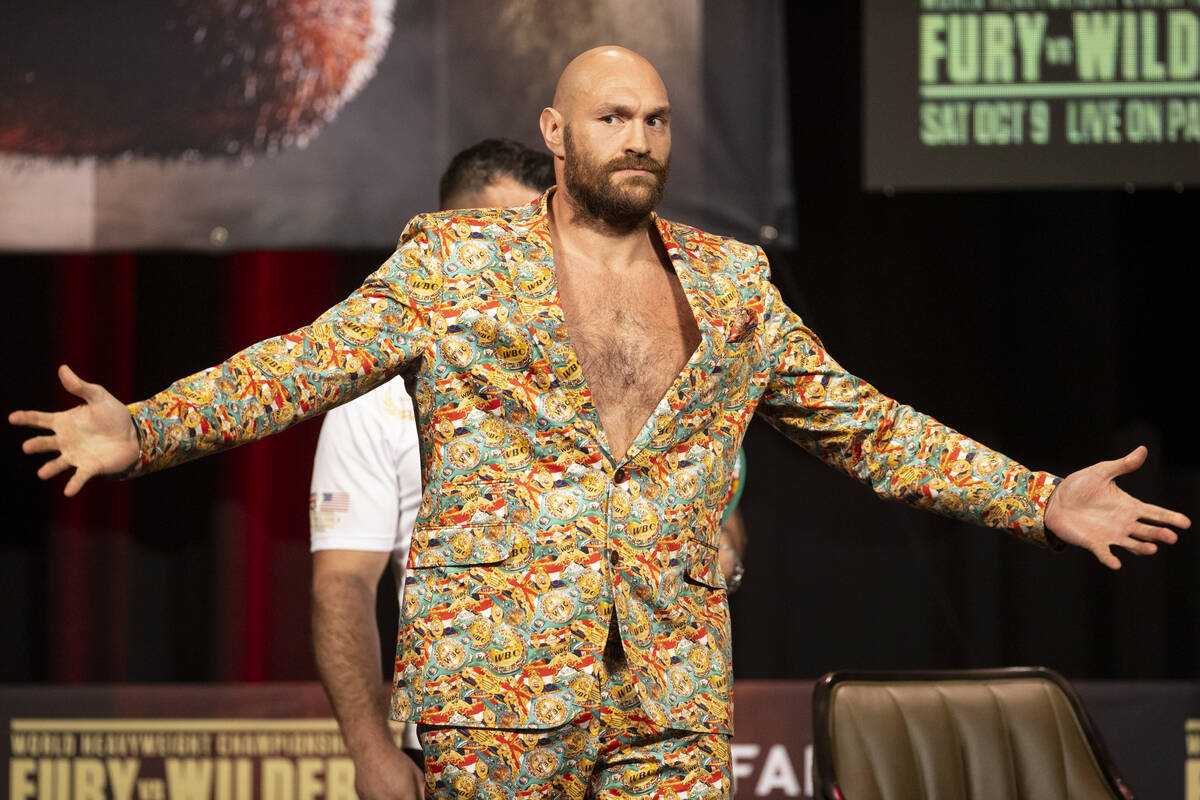 Tyson Fury poses during a press conference in advance of his heavyweight title fight against De ...
