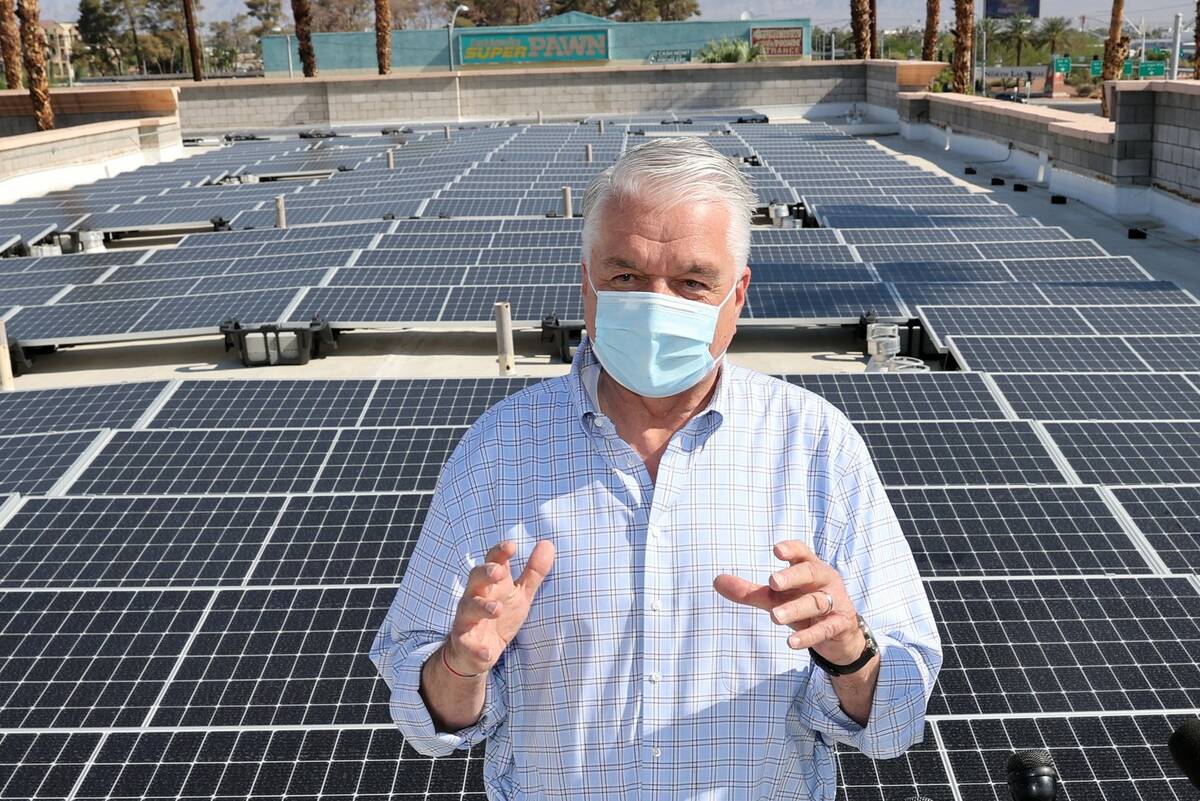 Nevada Gov. Steve Sisolak, seen at a rooftop solar facility in Las Vegas in August 2021. (K.M. ...