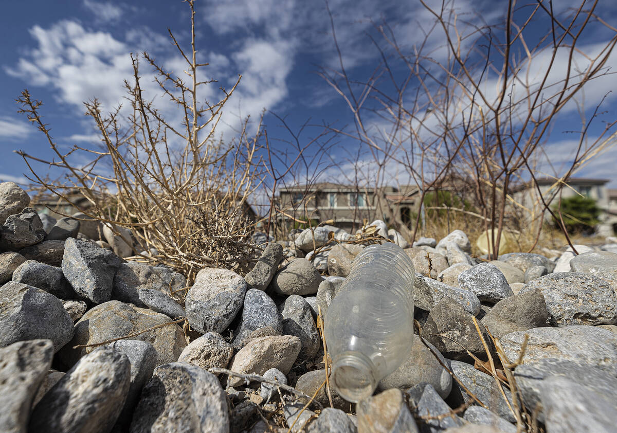 An empty water bottle in a vacant field on Saturday, Oct. 9, 2021, in Las Vegas. (Benjamin Hage ...