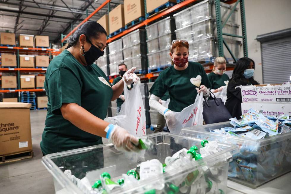 Latisha Casas, chairwoman of San Manuel Gaming & Hospitality Authority, left, packs a bag f ...