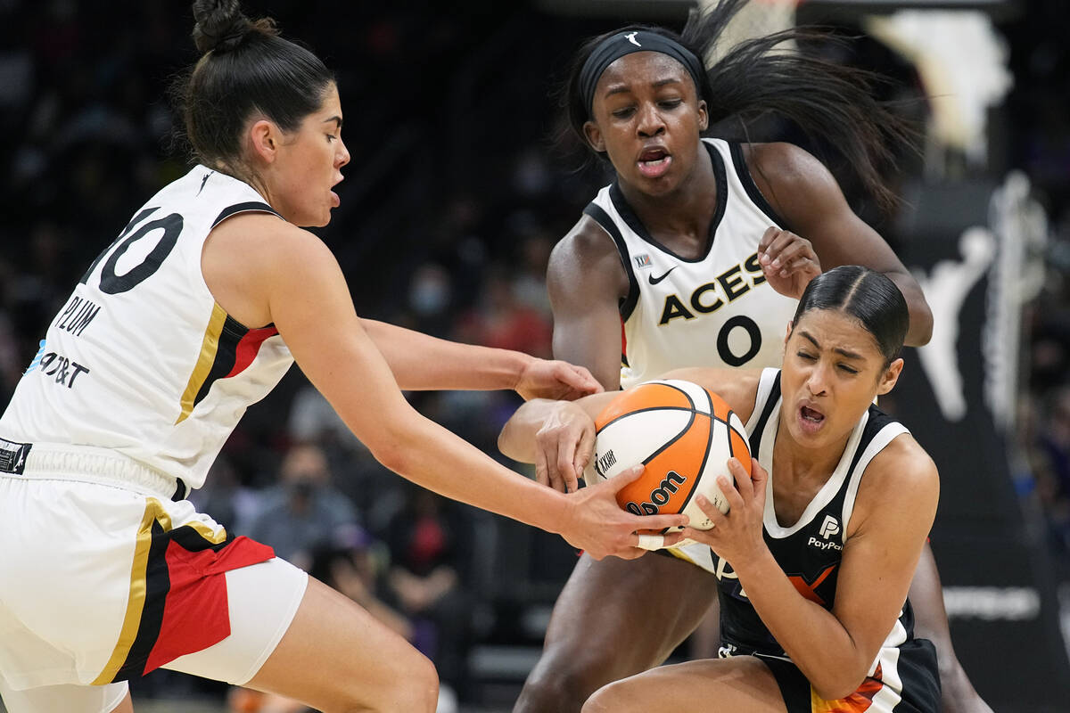 Phoenix Mercury guard Skylar Diggins-Smith vies for the ball with Las Vegas Aces guard Kelsey P ...
