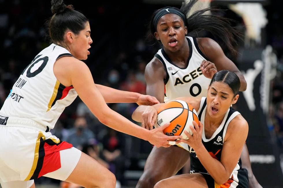 Phoenix Mercury guard Skylar Diggins-Smith vies for the ball with Las Vegas Aces guard Kelsey P ...