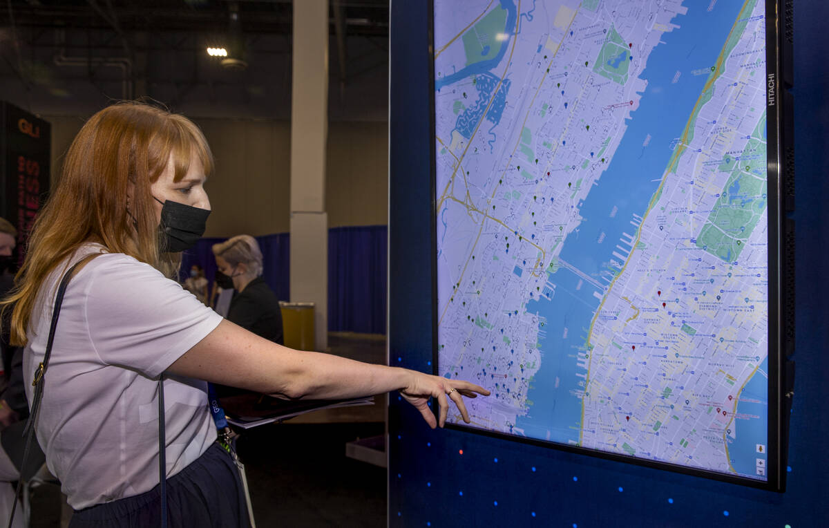 Lindsay Slader with Geocomply Solutions, Inc., shows how their system operates on an interactiv ...