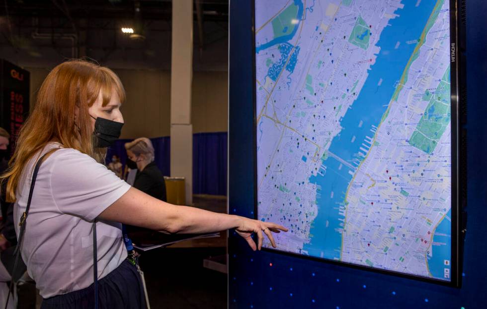Lindsay Slader with Geocomply Solutions, Inc., shows how their system operates on an interactiv ...