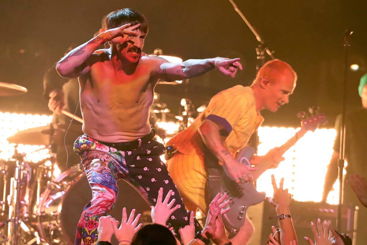 Anthony Kiedis, left, and Flea, of Red Hot Chili Peppers, perform a medley at the 61st annual G ...