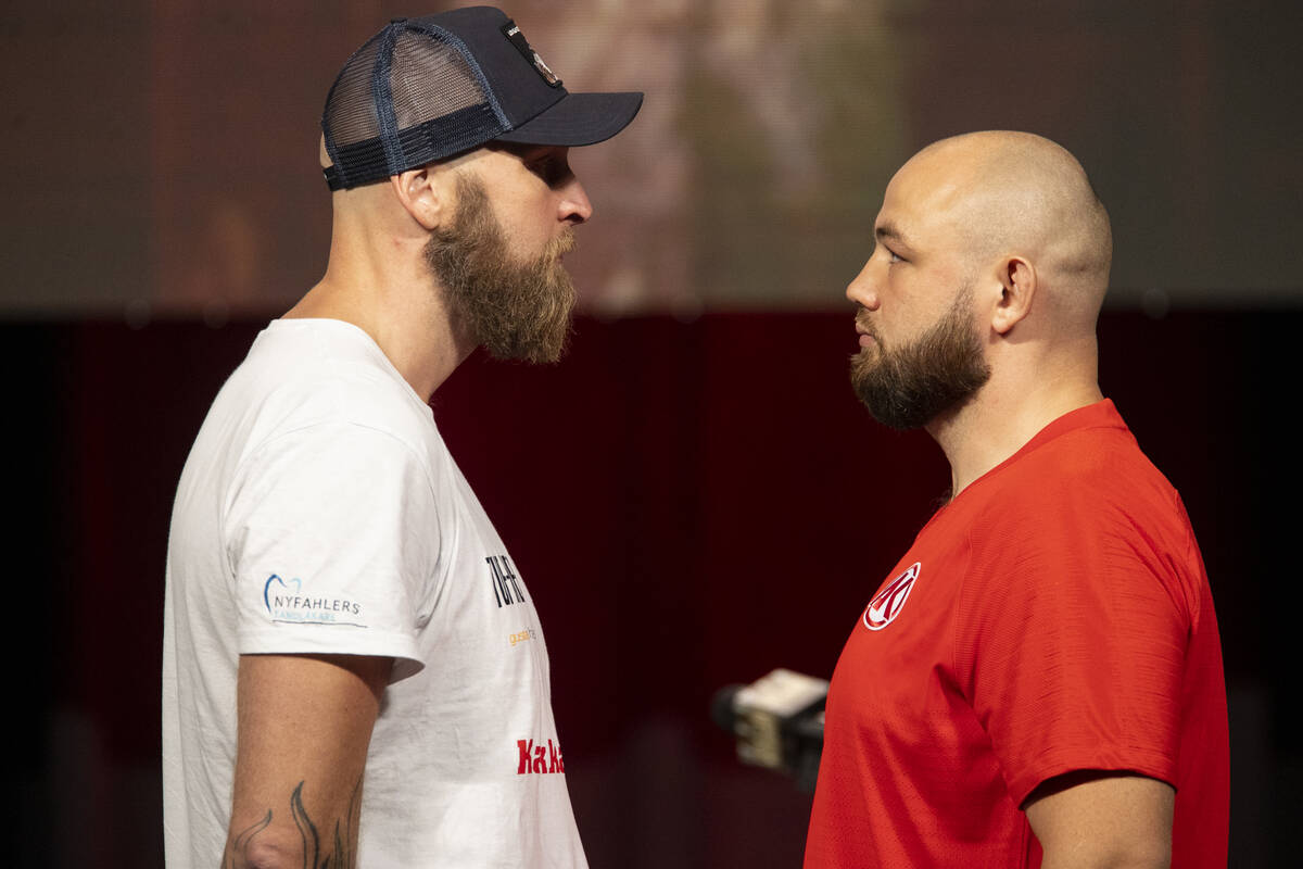 Robert Helenius, left, and Adam Kownacki, pose during a press conference at the MGM Grand Garde ...
