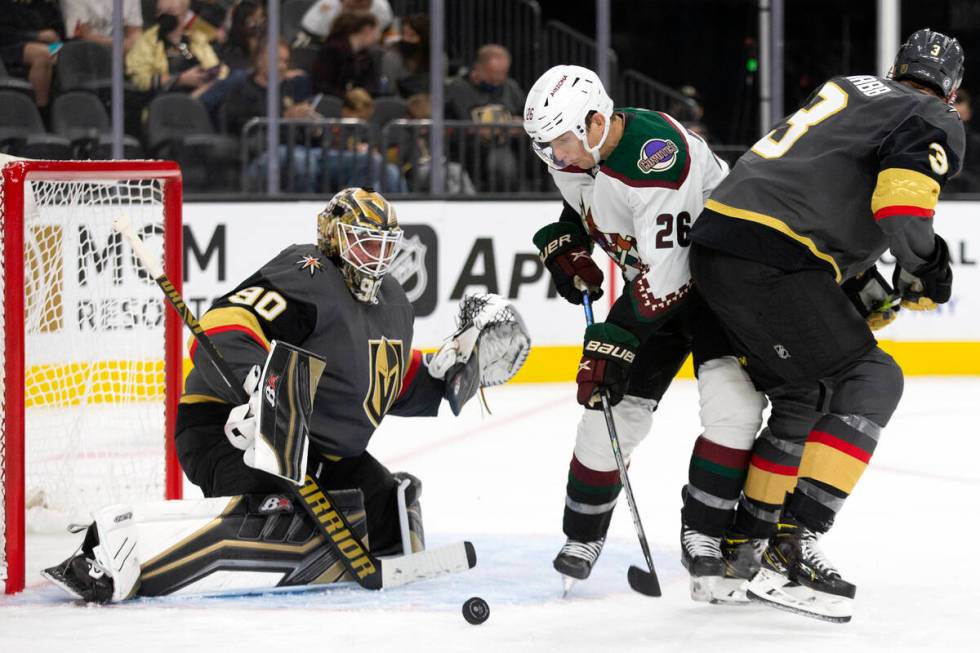 Coyotes left wing Antoine Roussel (26) attempts to shoot a goal as Golden Knights goaltender Ro ...