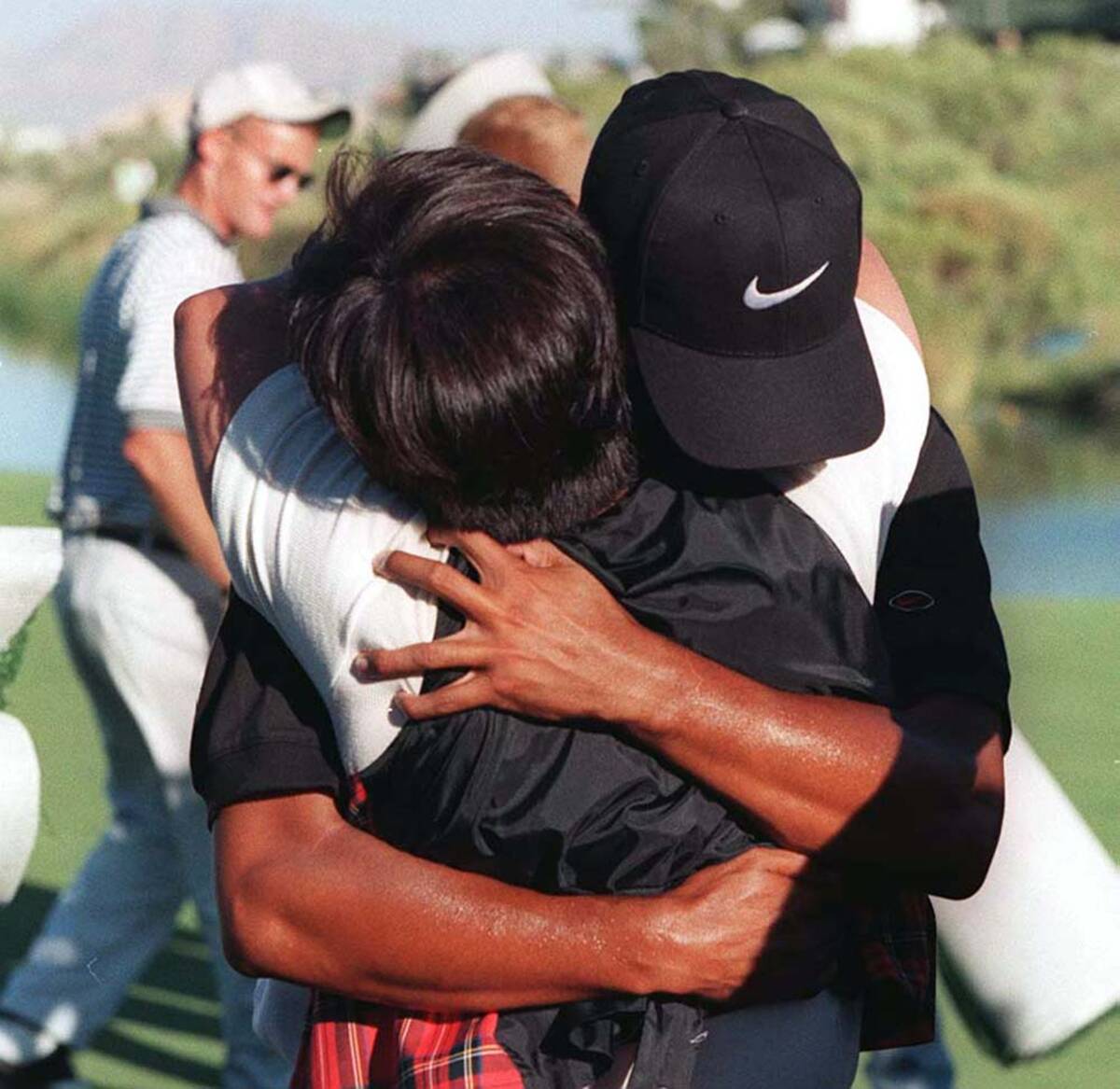 Tiger Woods hugs his mother after winning the Las Vegas Invitational on 10 6 96 jeff scheid ...