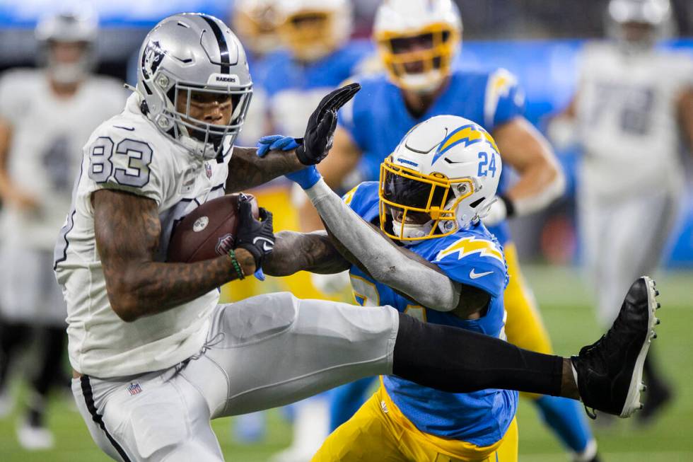 Raiders tight end Darren Waller (83) makes a catch against Los Angeles Chargers defensive back ...