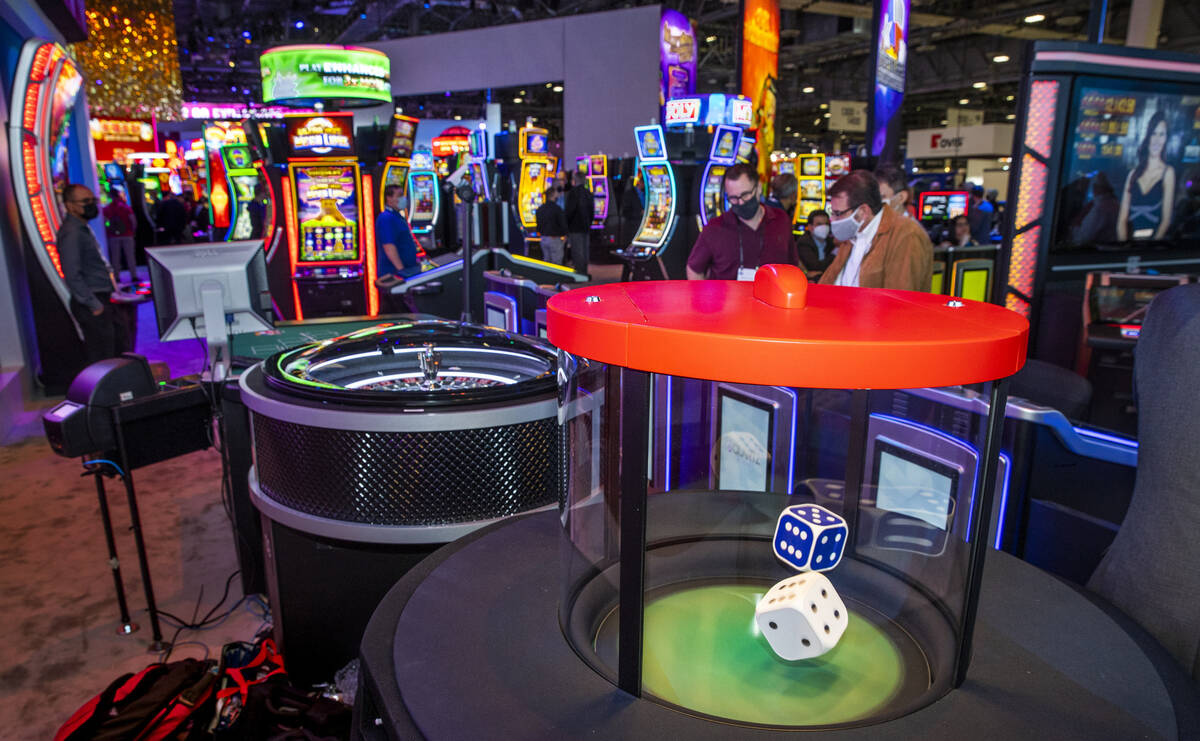 Dice hop during a roll in the new stadium seating and gaming spot about the Scientific Games Co ...