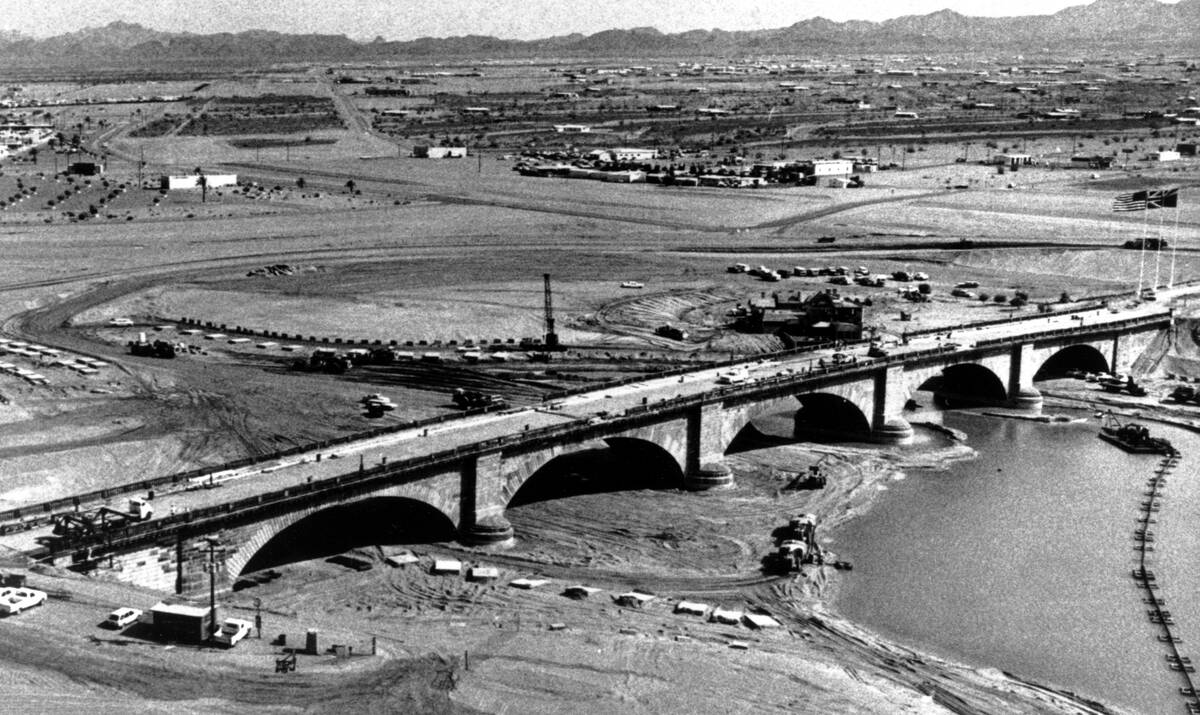The historic London Bridge straddles a moat of water during its reconstruction in Lake Havasu C ...