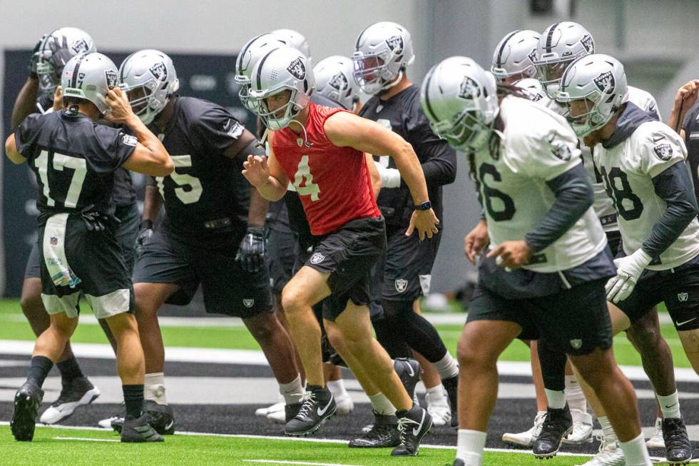 Raiders quarterback Derek Carr (4) leads the team during a practice session at the Raiders Head ...