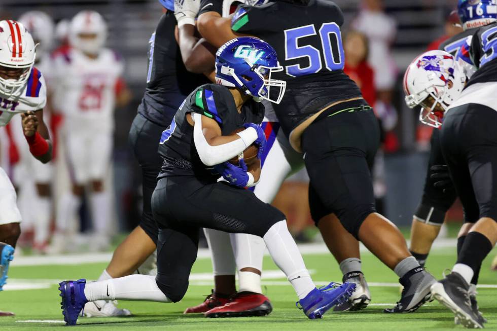 Green Valley's Josiah Edwards (25) runs the ball against Liberty in the first half of a footbal ...