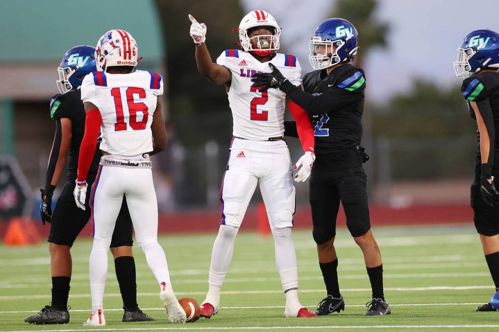 Liberty's Germie Bernard (2) signals a first down after his run in the first half of a football ...