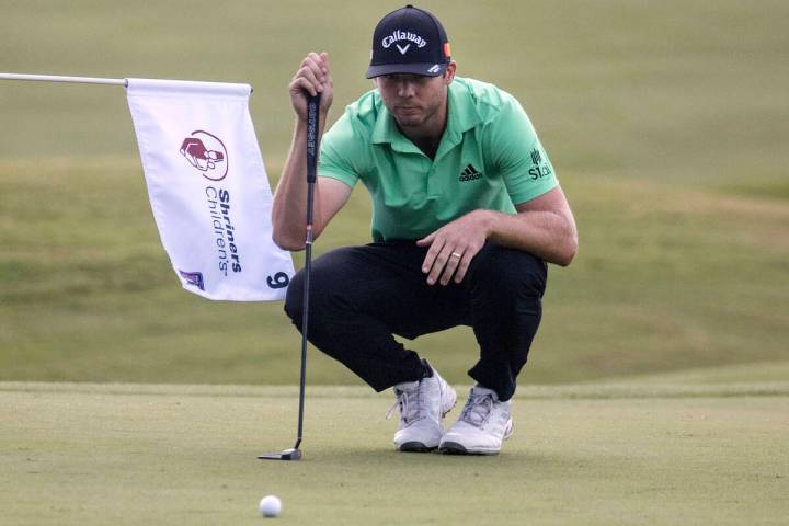 Sam Burns of Shreveport, La., lines up a putt at the 18th hole during the second round of the S ...