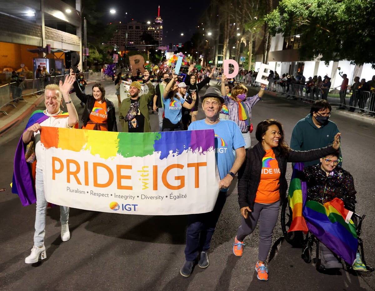 Members of International Game Technology entry march in the Las Vegas Pride Night parade downto ...