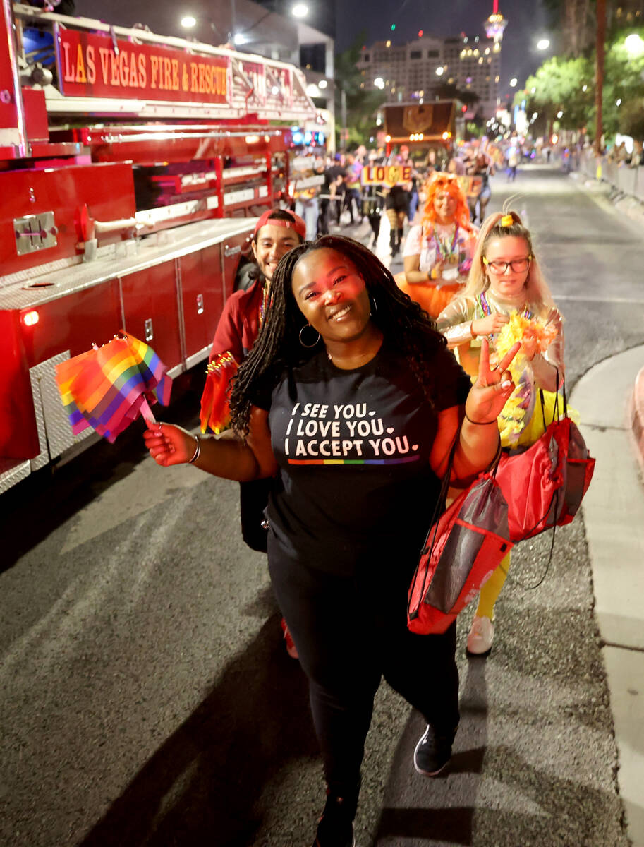 Members of the City of Las Vegas entry march in the Las Vegas Pride Night parade downtown Frida ...