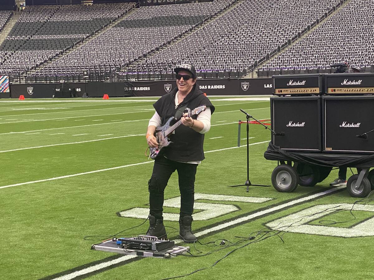 Neal Schon plays during a rehearsal Saturday at Allegiant Stadium for his Sunday performances a ...