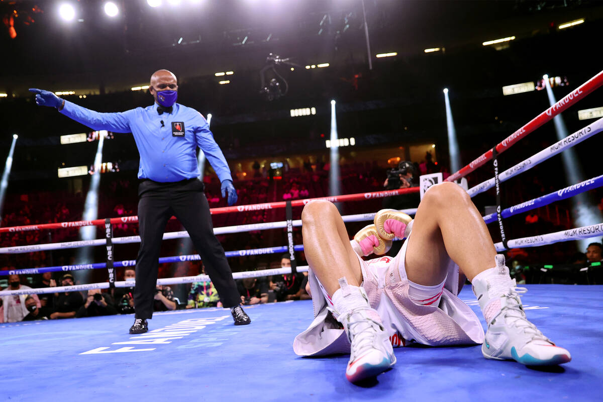 Edgar Berlanga falls on his back after getting knocked down by Marcelo Esteban Coceres in the n ...