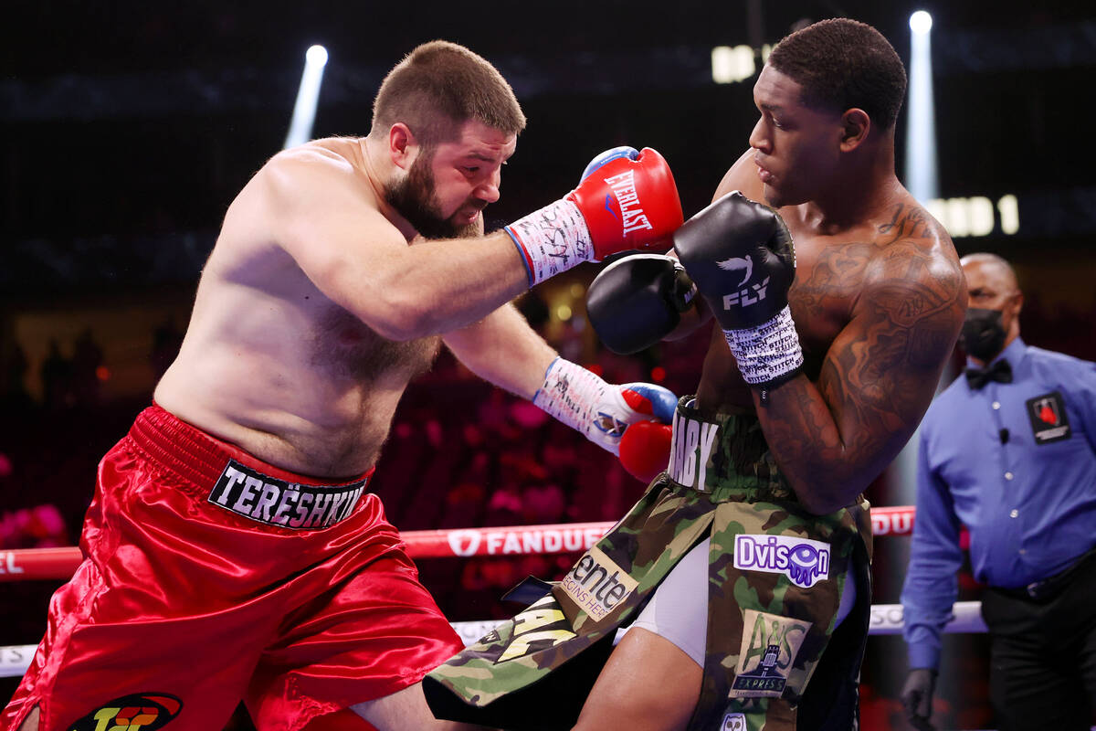 Vladimir Tereshkin, left, and Jared Anderson, battle in the first round of a heavyweight bout a ...