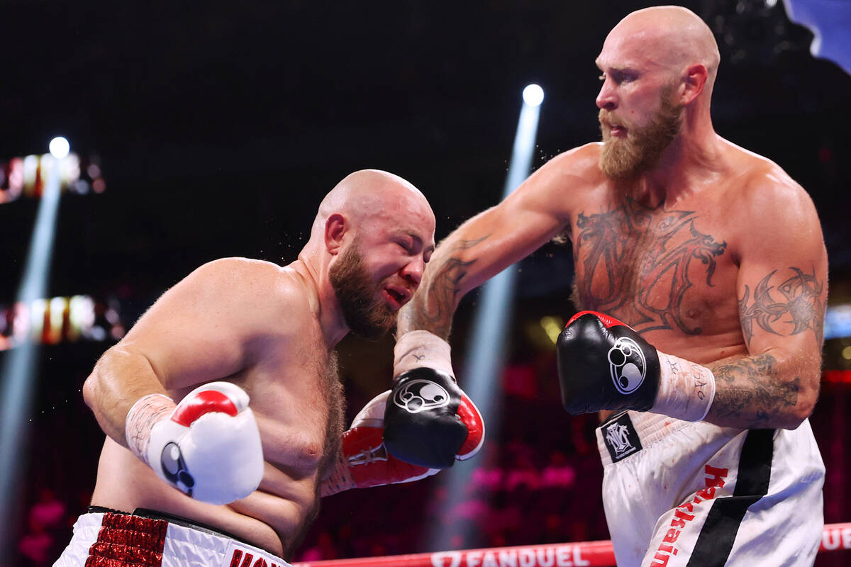 Robert Helenius, right, connects a punch against Adam Kownacki in the sixth round of a heavywei ...