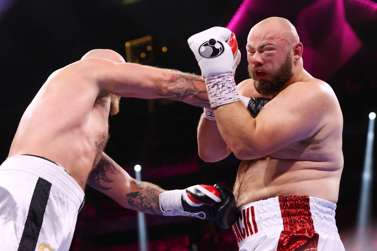 Robert Helenius, left, connects a punch against Adam Kownacki in the third round of a heavyweig ...