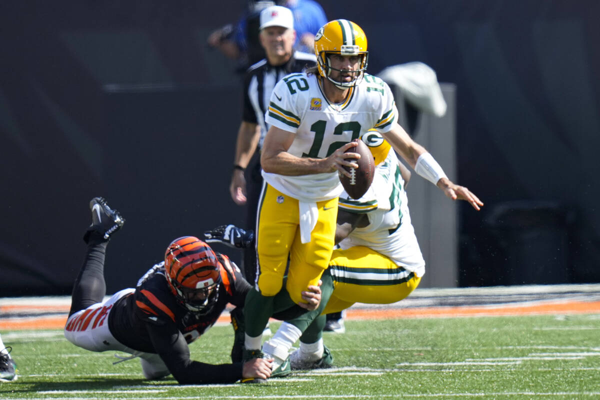 Green Bay Packers quarterback Aaron Rodgers (12) is sacked by Cincinnati Bengals defensive end ...