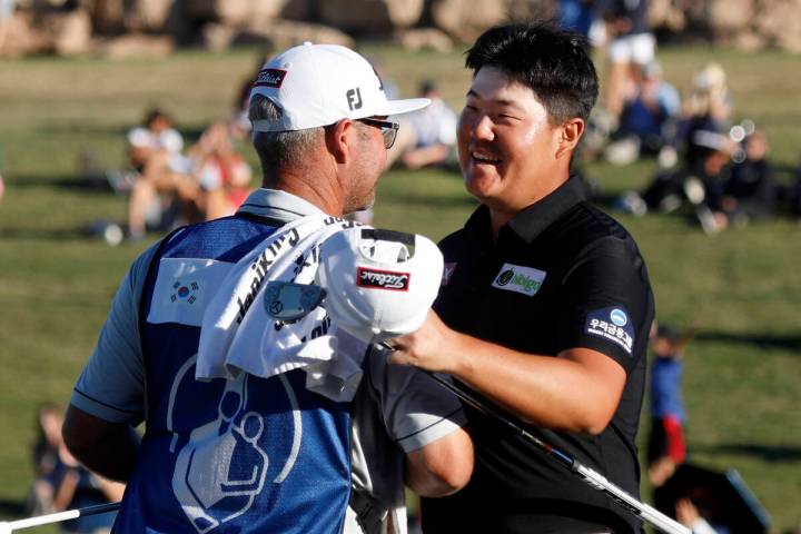 Sungjae Im, right, celebrates with his caddie after he won the final round of the Shriners Hosp ...