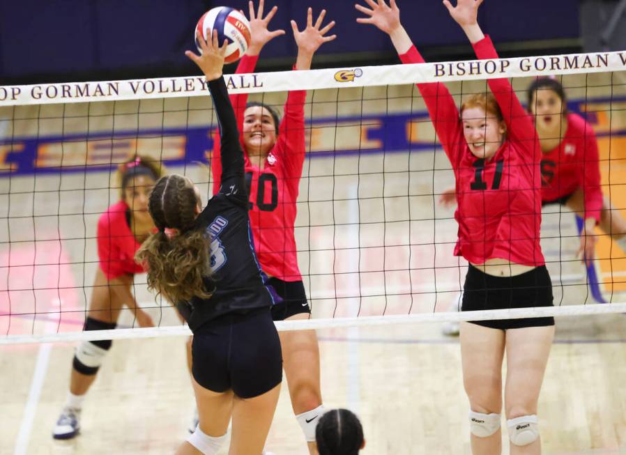 Bishop Gorman's setter Caroline Edgeworth (10) and Bishop Gorman's middle blocker Ashley Duckwo ...