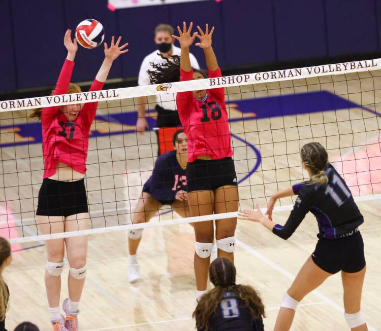 Bishop Gorman's middle blocker Ashley Duckworth (17) blocks a shot from Silverado's Jenna Desel ...