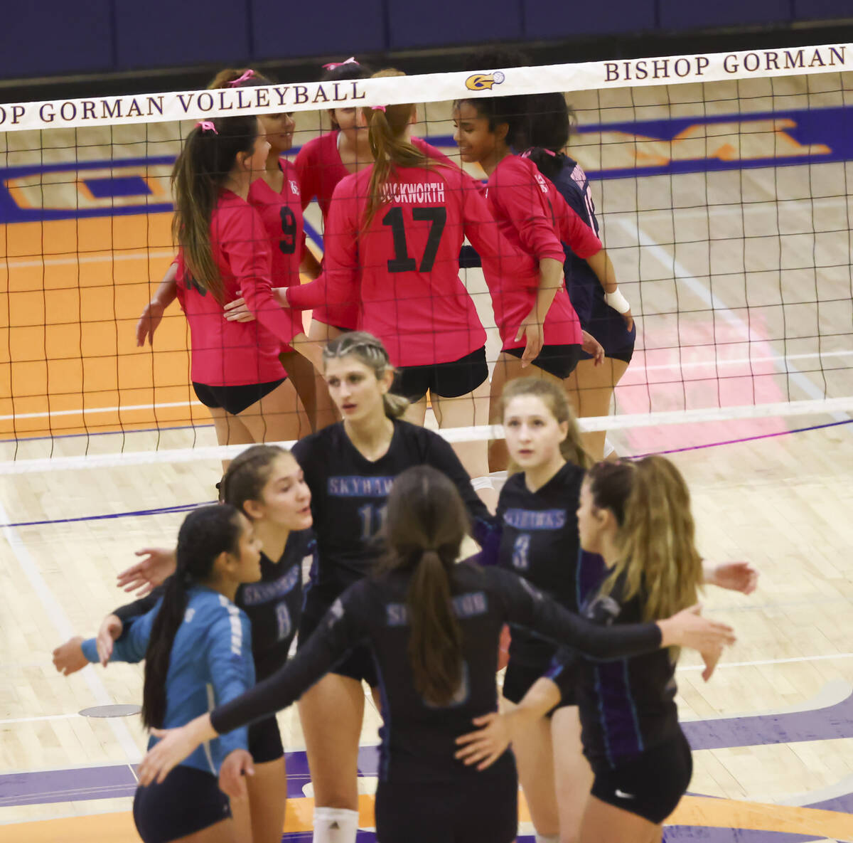 Bishop Gorman and Silverado players huddle after a play during a volleyball game at Bishop Gorm ...