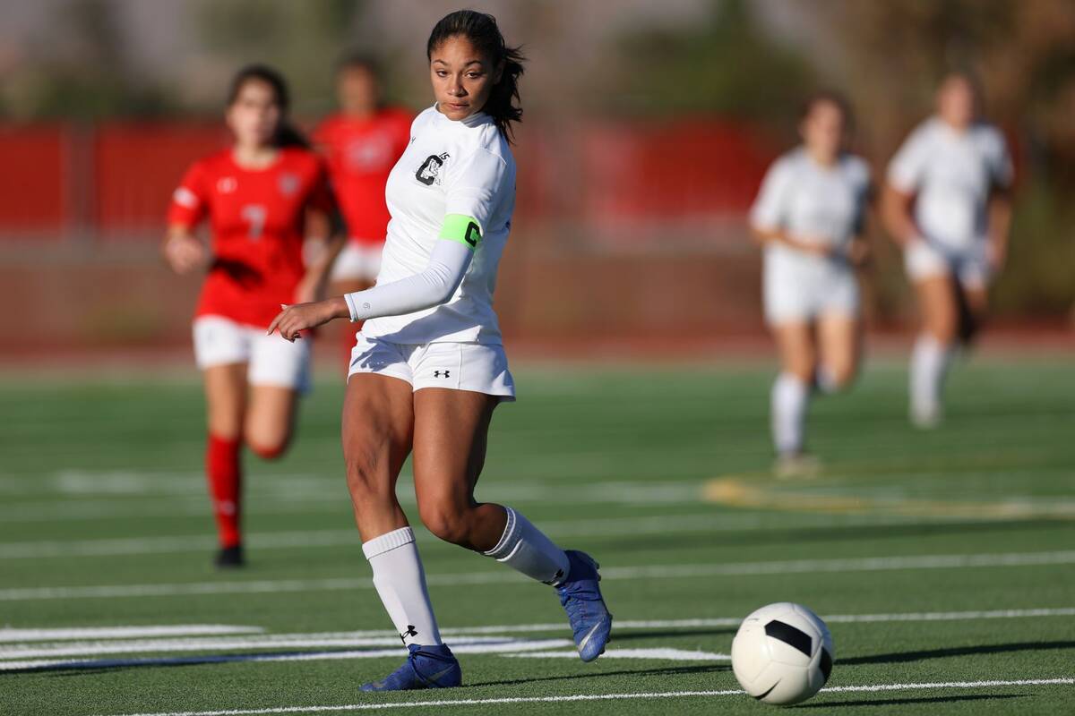 Centennial's Syrena Taylor (13), makes a pass during the first half of a girl's soccer game aga ...