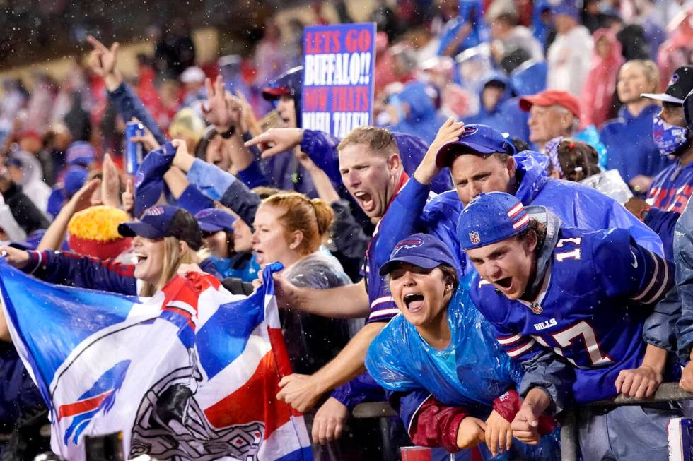 Buffalo Bills fans celebrate late in an NFL football game against the Kansas City Chiefs Sunday ...