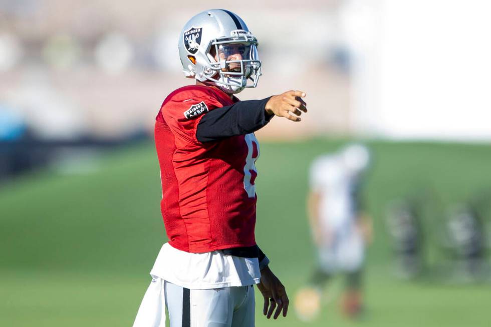 Raiders quarterback Marcus Mariota (8) reacts after throwing a pass during their NFL training c ...