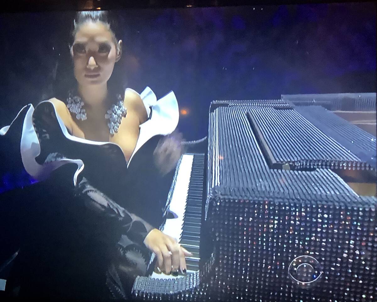 A screen grab of Chloe Flower playing Liberace's rhinestone Baldwin during CBS's Grammy Awards ...