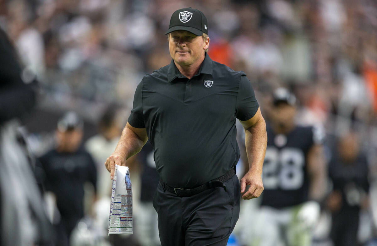 Raiders head coach Jon Gruden runs off the field for halftime during an NFL football game again ...