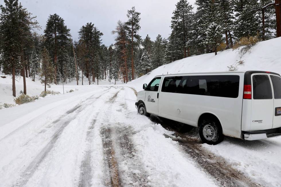 A shuttle van sits stuck in the snow at the Lee Canyon ski area on Mount Charleston northwest o ...