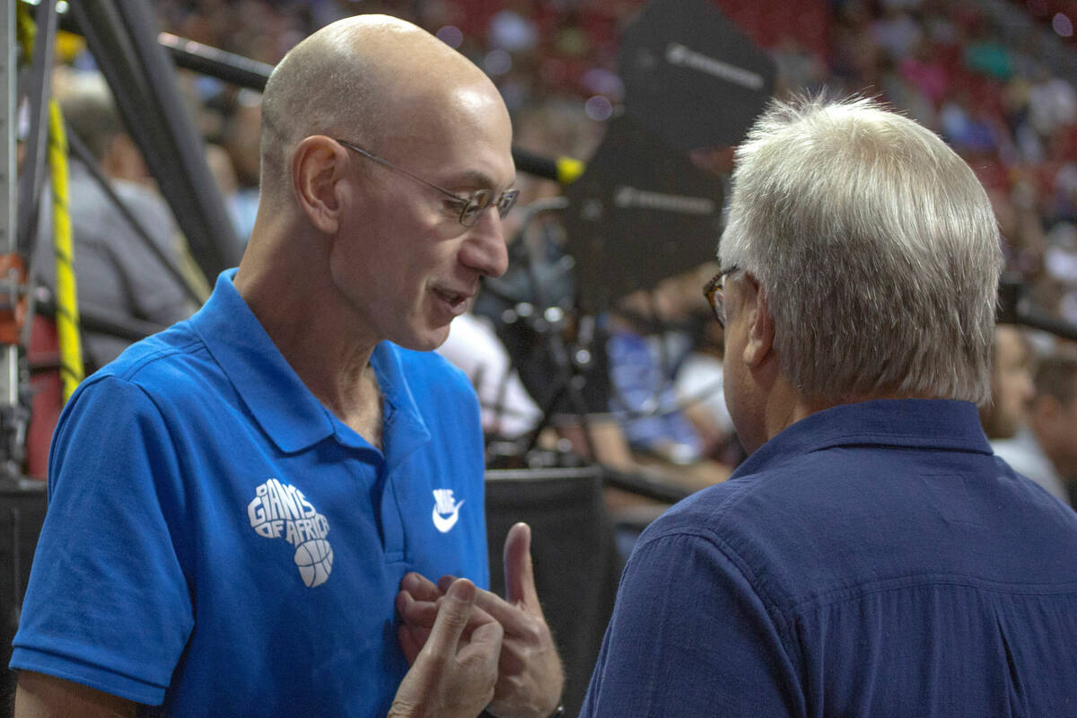 NBA Commissioner Adam Silver talks to Summer League Executive director Warren LeGarie during th ...