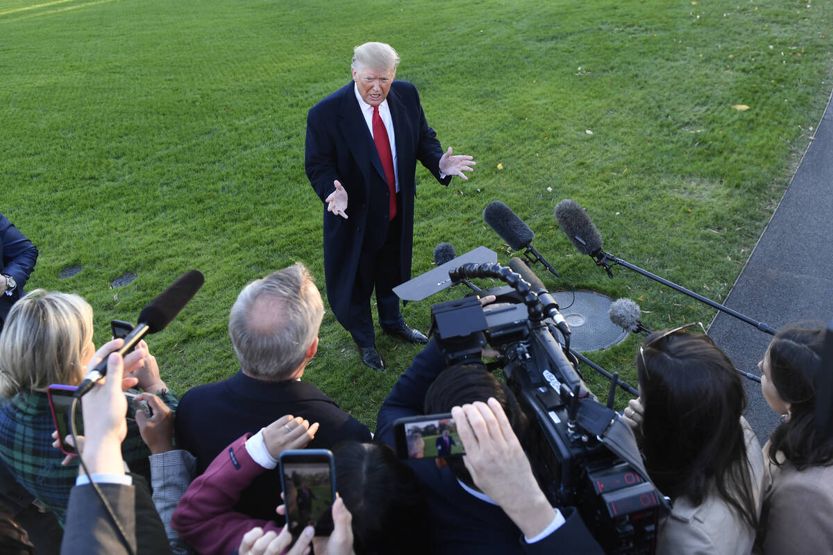 Donald Trump talks to reporters on the South Lawn of the White House. (AP Photo/Susan Walsh)